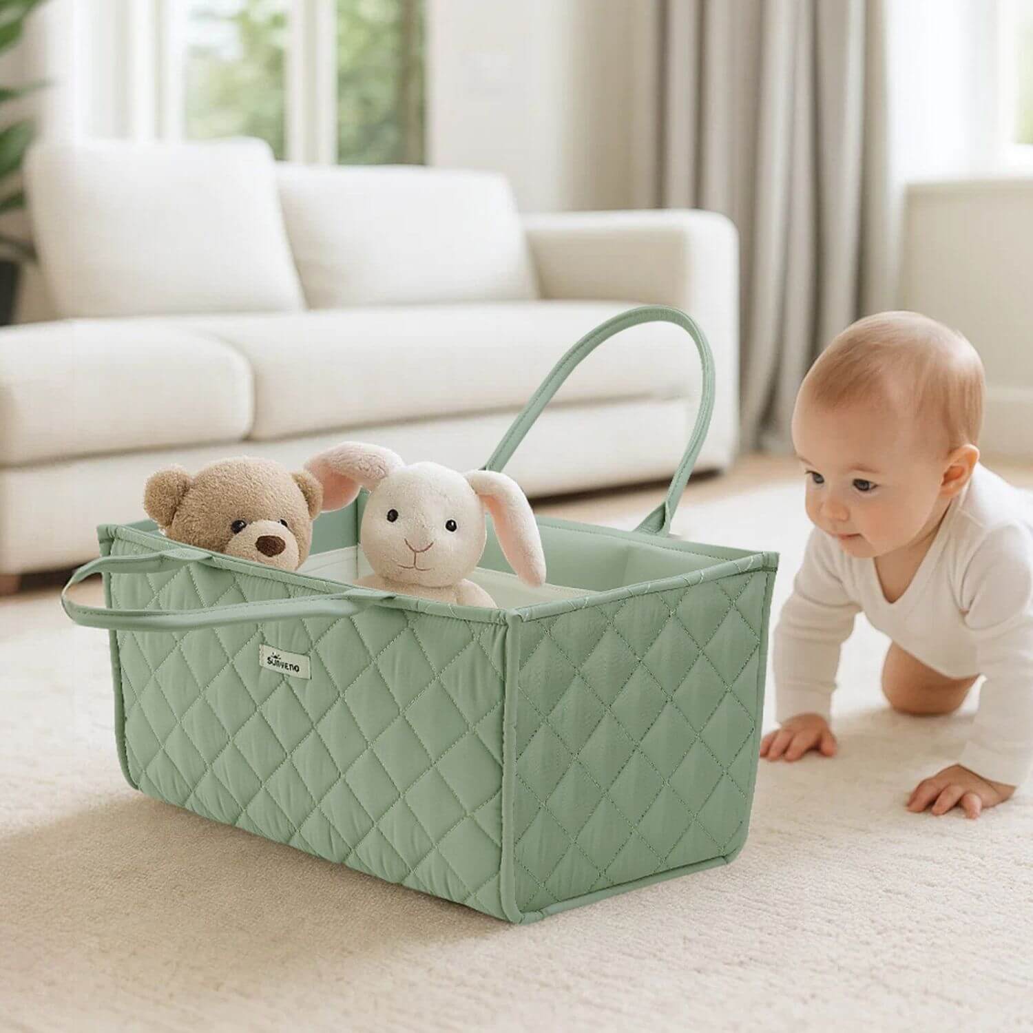 Sunveno Quilted Diaper Caddy Organizer - Green with plush toys next to a baby in a living room.