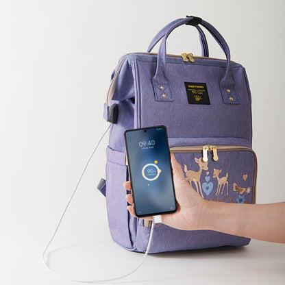 Sunveno Classic Embroidered Diaper Backpack - Purple Deer with a phone and charging cable on a white background