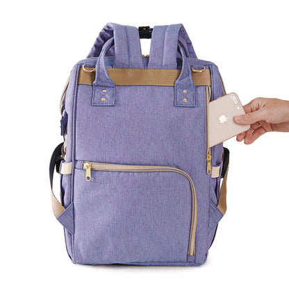 Sunveno Classic Embroidered Diaper Backpack - Purple Deer and a hand holding a phone on a white background