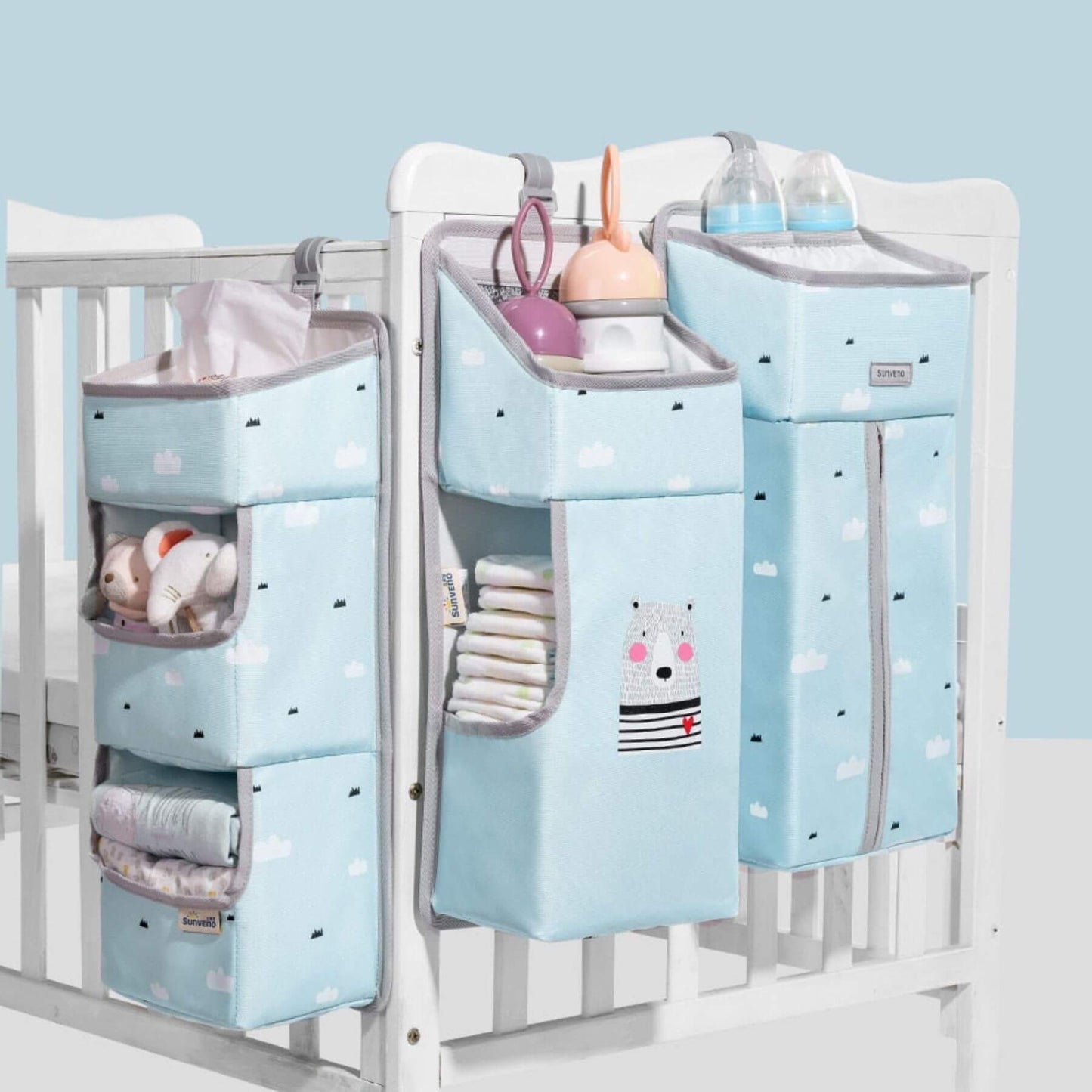 Crib with Sunveno 3-in-1 Crib Organizer on a light blue background