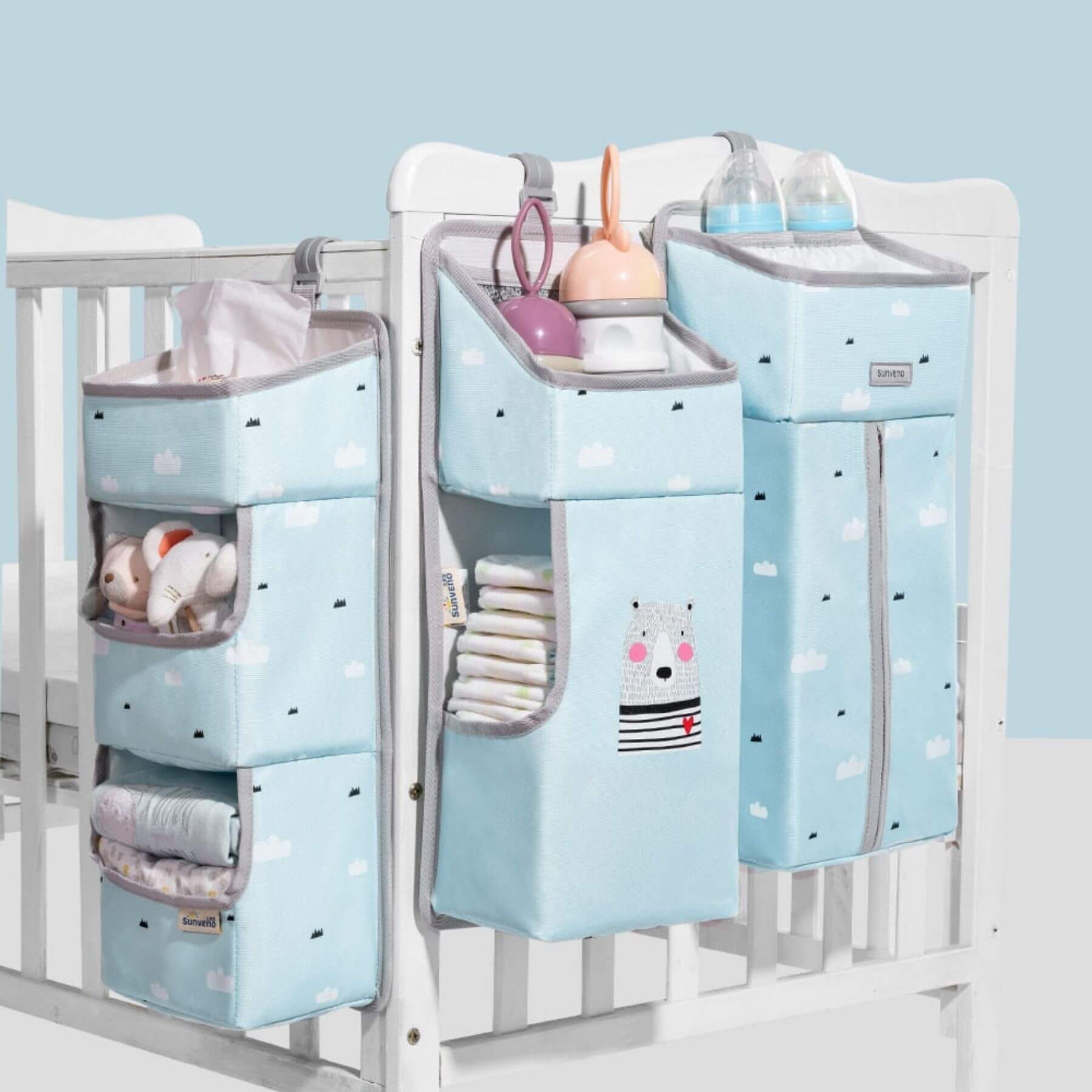 Crib with Sunveno 3-in-1 Crib Organizer on a light blue background