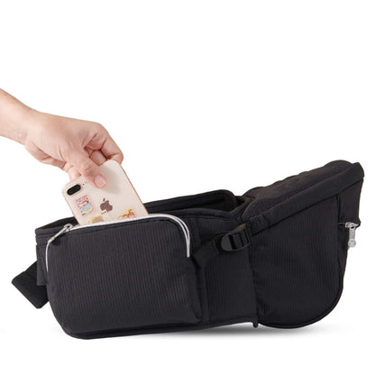Sunveno Easy Hold Baby Hipseat Carrier a hand placing a phone into one of its pockets on a white background