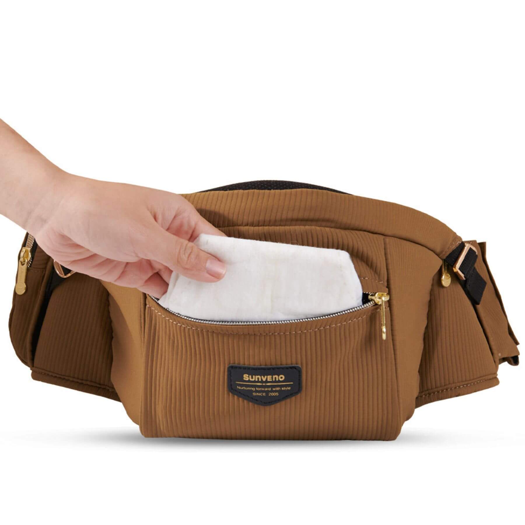 Sunveno Easy Hold Baby Hipseat Carrier - Brown with a hand reaching in to take out a white cloth, on a white background.