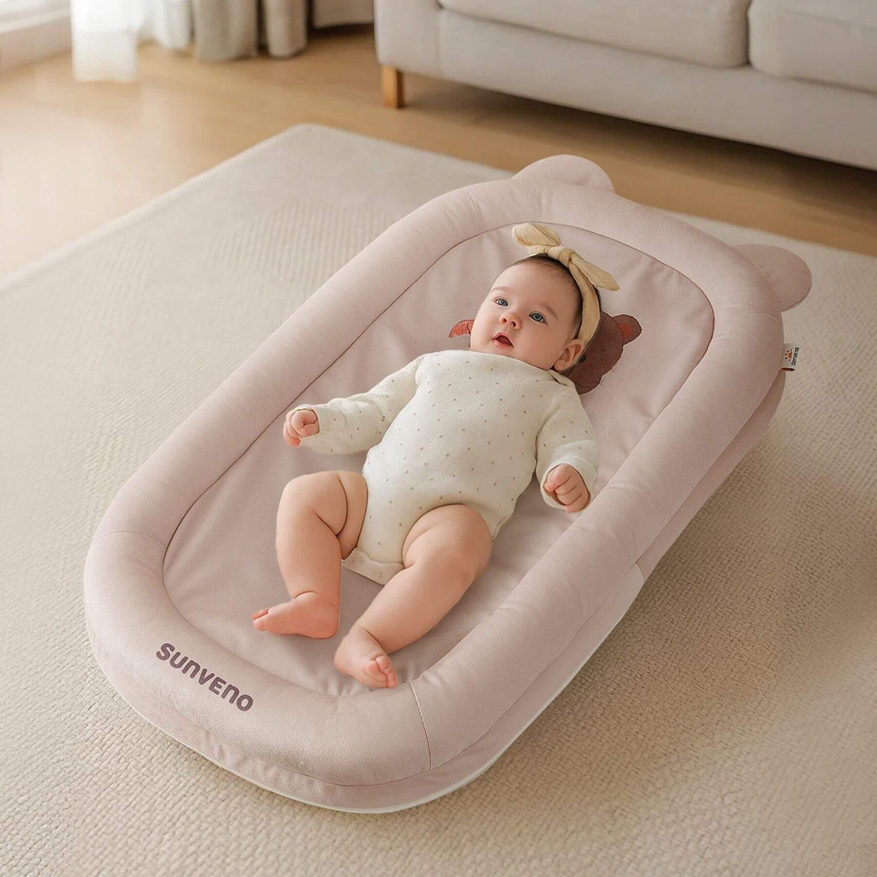 Baby sleeps on Sunveno Baby Lounger for Newborns - Brown