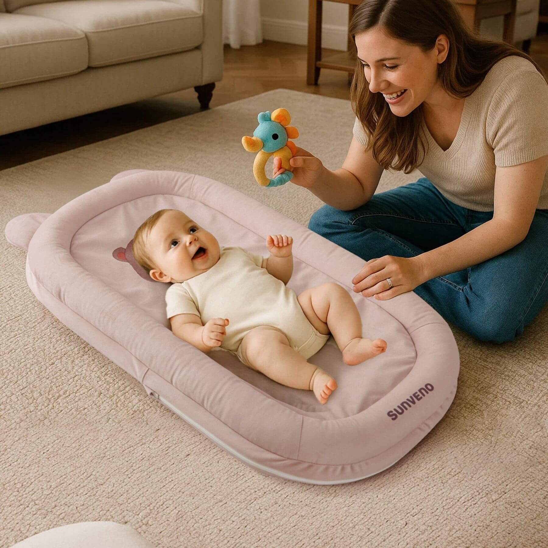 Woman plays with a baby on Sunveno Baby Lounger for Newborns - Brown