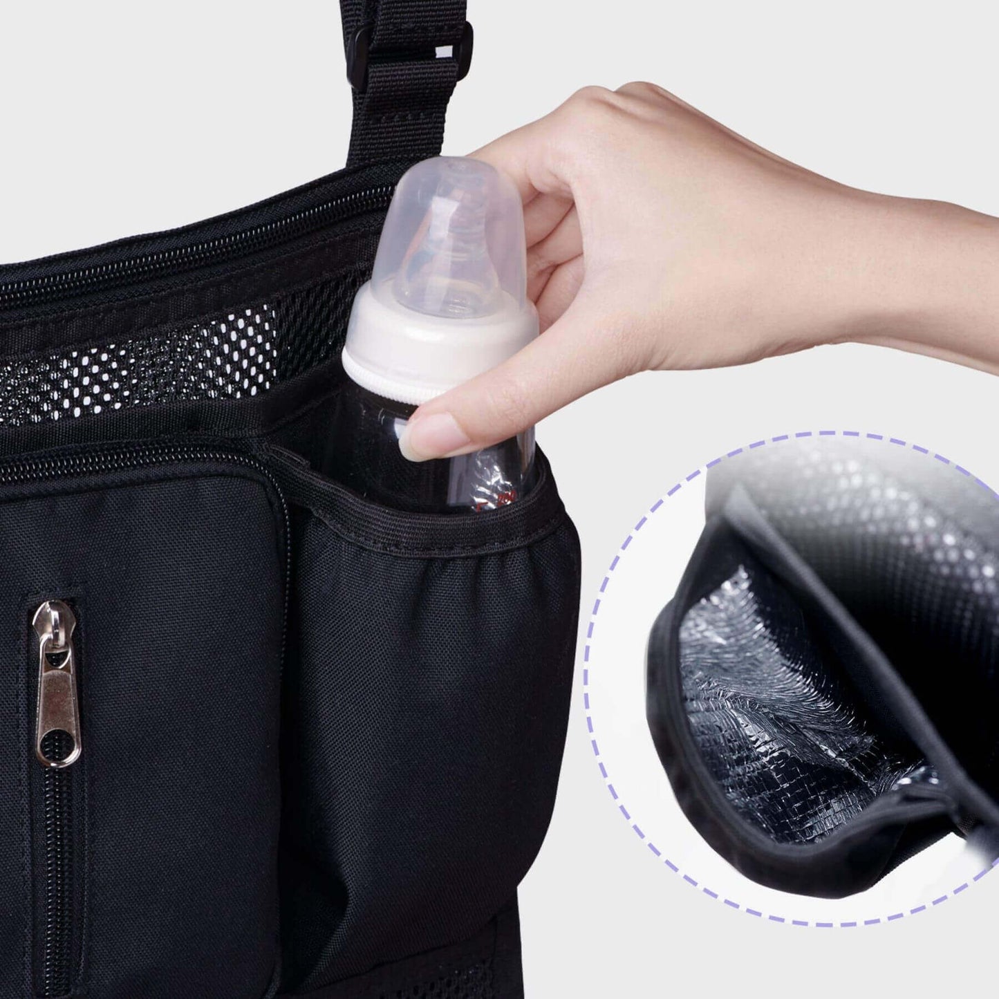 Hand putting a milk bottle into Sunveno Mesh Stroller Organizer
