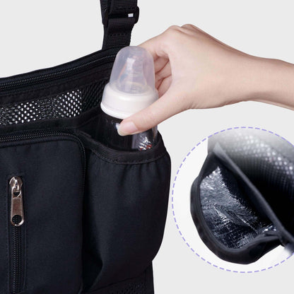 Hand putting a milk bottle into Sunveno Mesh Stroller Organizer