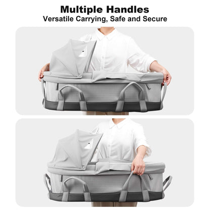 Person holding Sunveno Portable Baby Bassinet with multiple handles, emphasizing versatility, safety, and security.