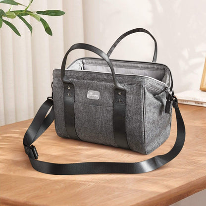 Sunveno Small Crossbody Diaper Bag on a wooden surface