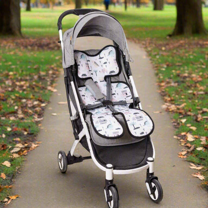 Stroller with Sunveno Breathable Stroller Pad on a paved path in a park