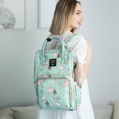 Woman Carrying Sunveno Timeless Baby Diaper Backpack - Green Unicorn