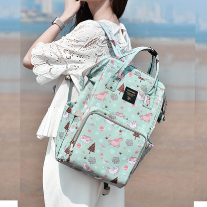Woman Carrying Sunveno Timeless Baby Diaper Backpack - Green Unicorn