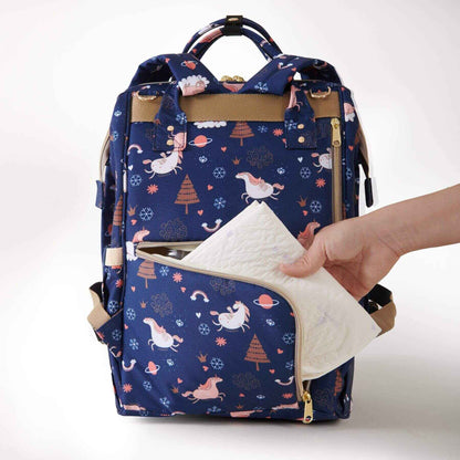 Hand putting tissues in Sunveno Timeless Baby Diaper Backpack - Navy Unicorn