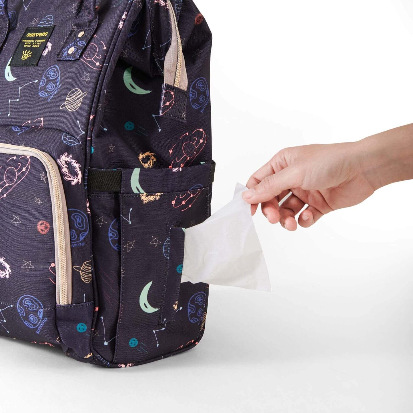 Hand reaching tissue in Sunveno Timeless Baby Diaper Backpack - Night Sky