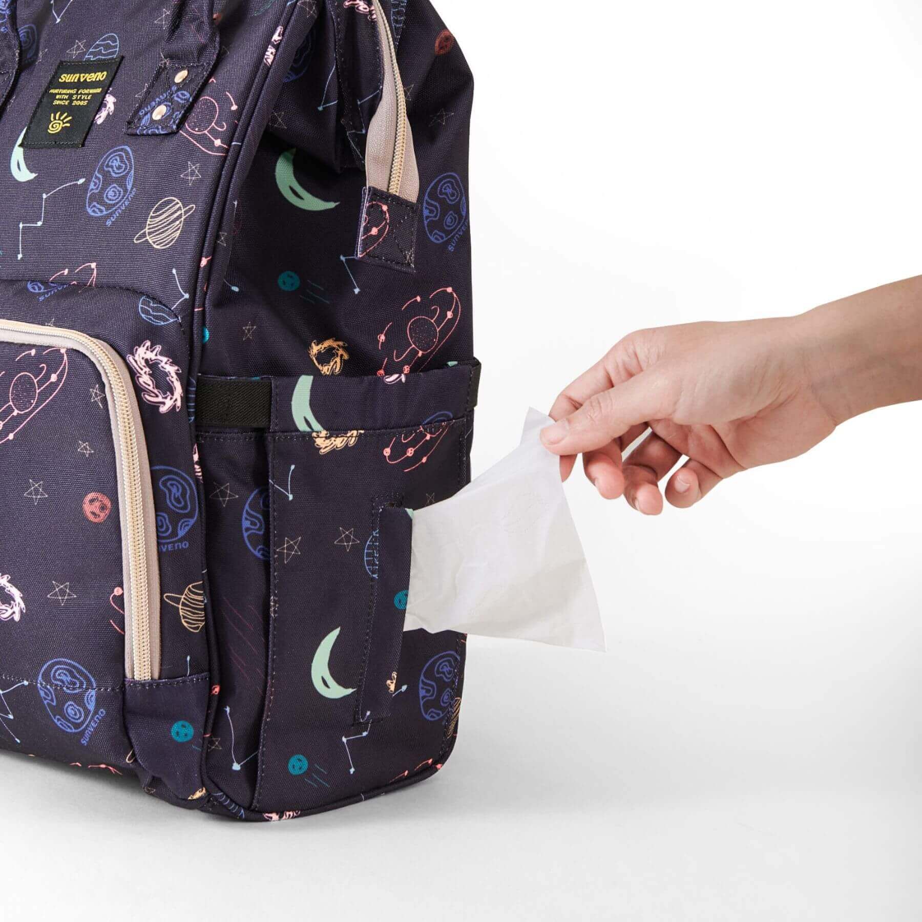 Hand reaching tissue in Sunveno Timeless Baby Diaper Backpack - Night Sky