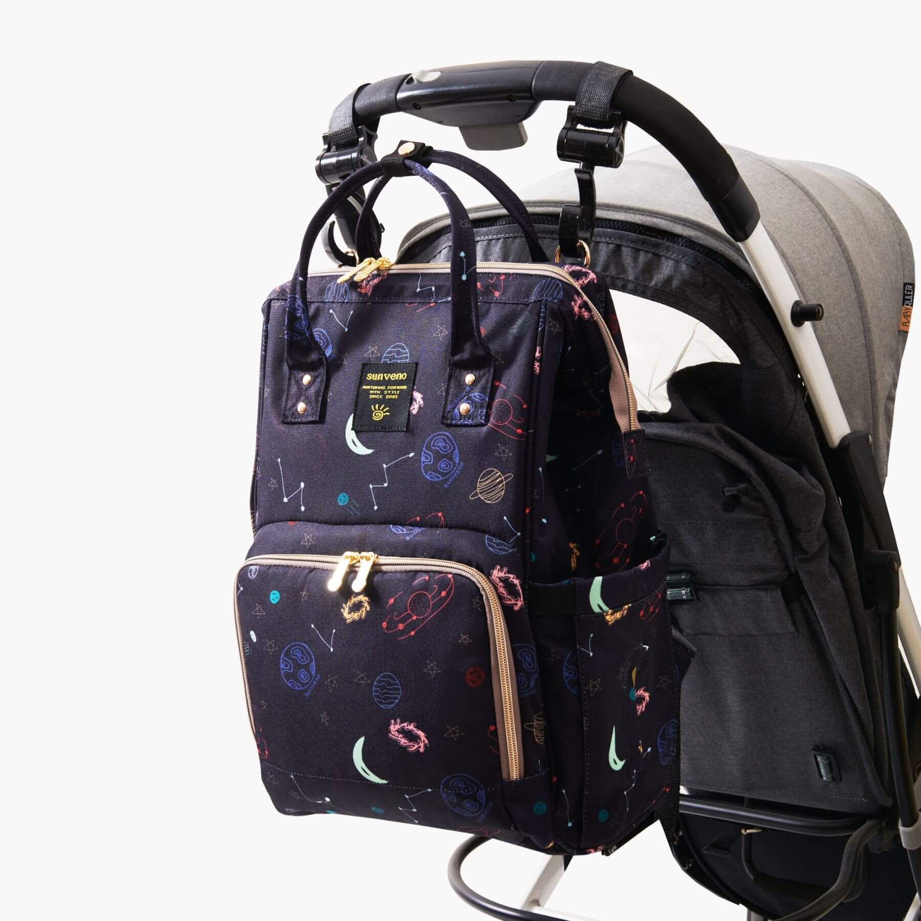Sunveno Timeless Baby Diaper Backpack - Night Sky attached to a stroller