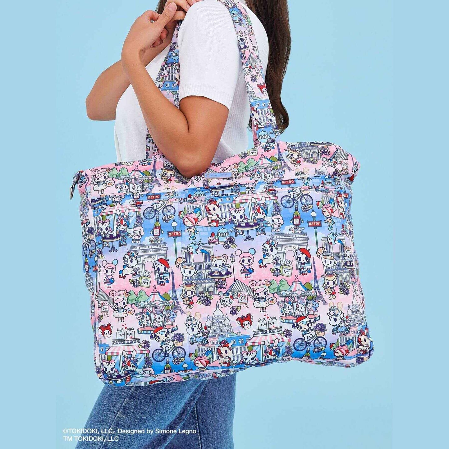 Woman carrying tokidoki Super Be Diaper Bag Tote - C'est la vie à Paris