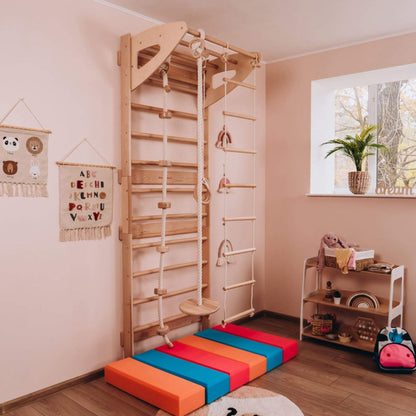 Children's playroom with Wood and Hearts Swedish Ladder Gym on the floor.