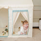 Child peeking out from Tiny Land® Sweet Citrus Kid's Play Tent - Creamy white/blue on the floor.