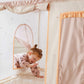 Child playing inside Tiny Land® Sweet Citrus Kid's Play Tent - Creamy white/pink.