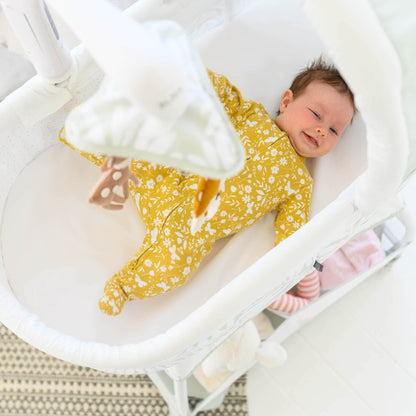 Baby Sleeping in TruBliss Sweetli Calm Bassinet Sage Fern Leaves