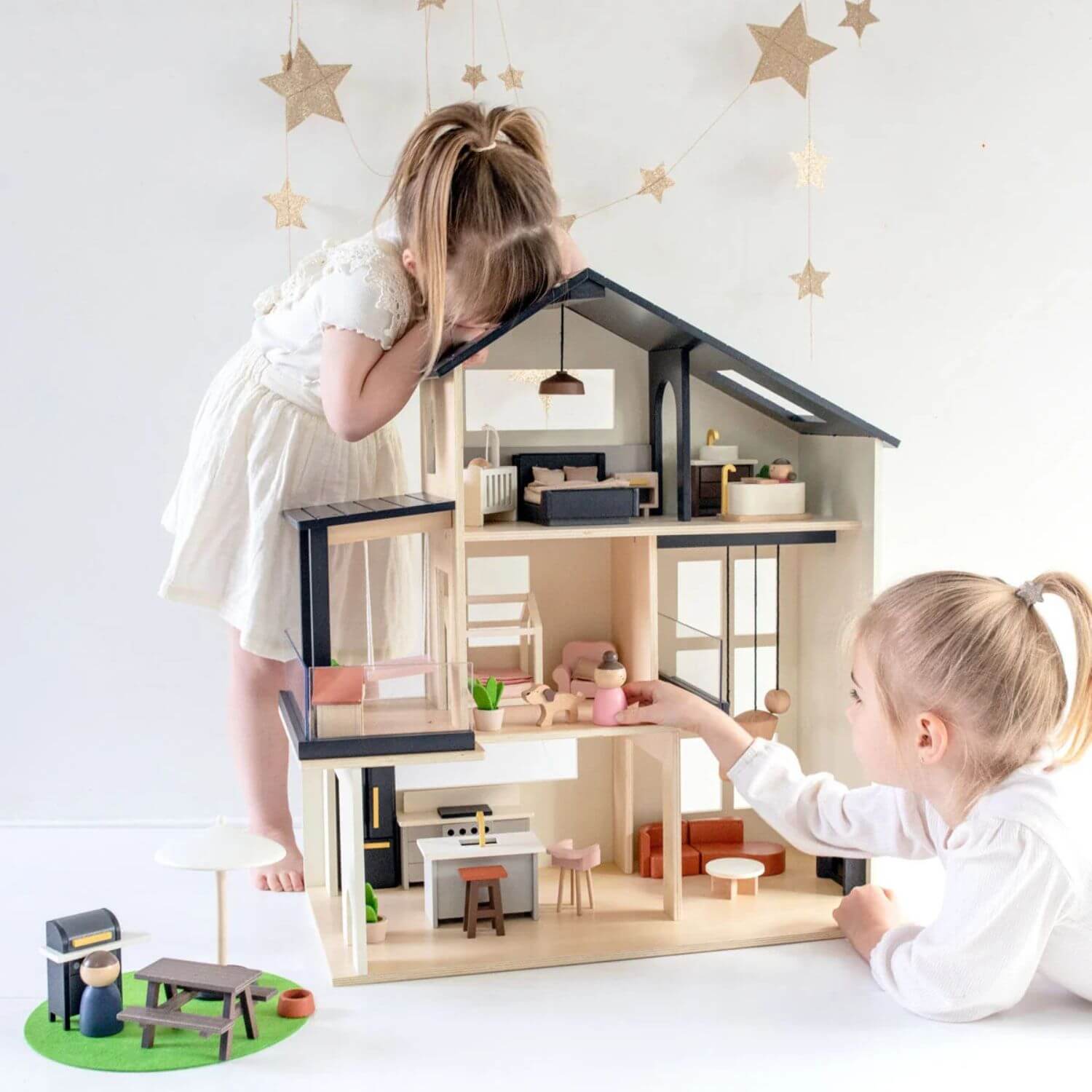 Girls Playing Tiny Land® Sweetwood Edge Dollhouse