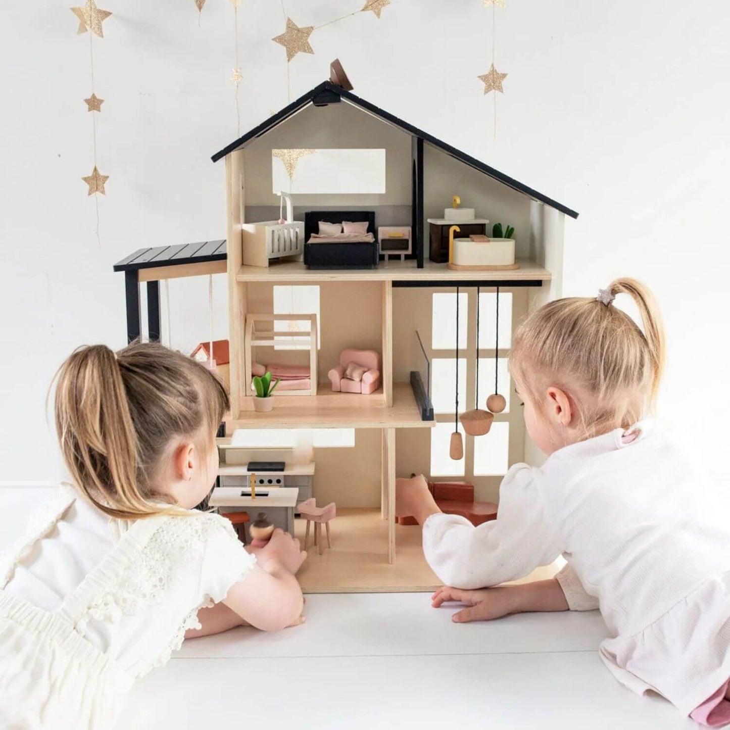 Girls Playing Tiny Land® Sweetwood Edge Dollhouse