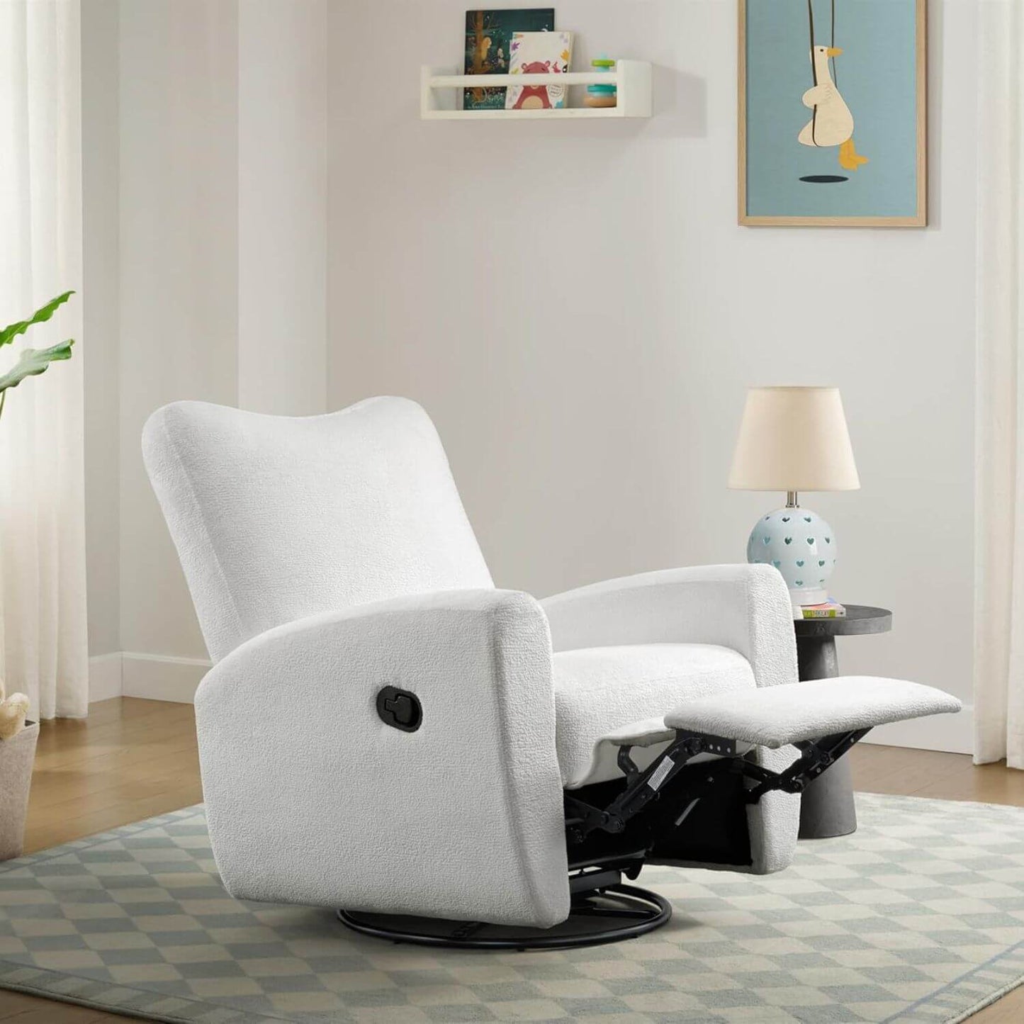 Oxford Baby Synergy Glider - Plush White in a living room setting with a lamp and decor items.