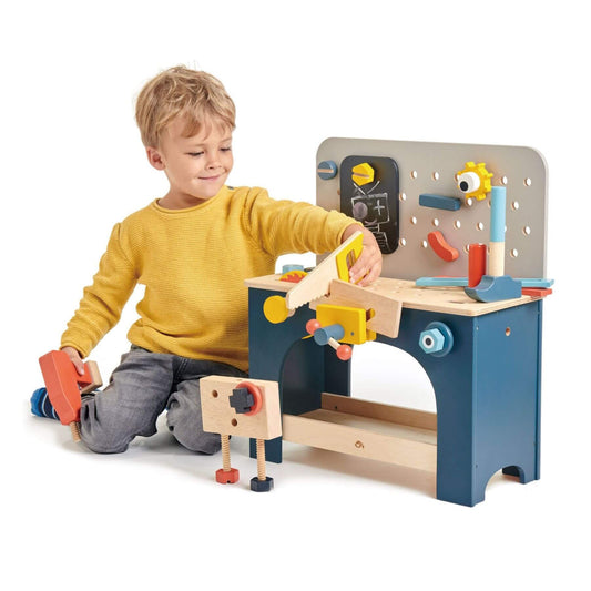 Child playing with Tender Leaf Table Top Tool Bench