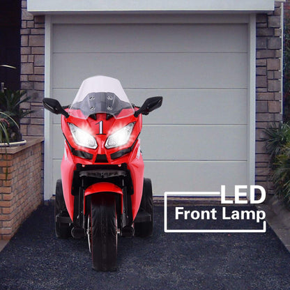 Tamco 12V Kids Electric Ride On Motorcycle - Red in front of a garage