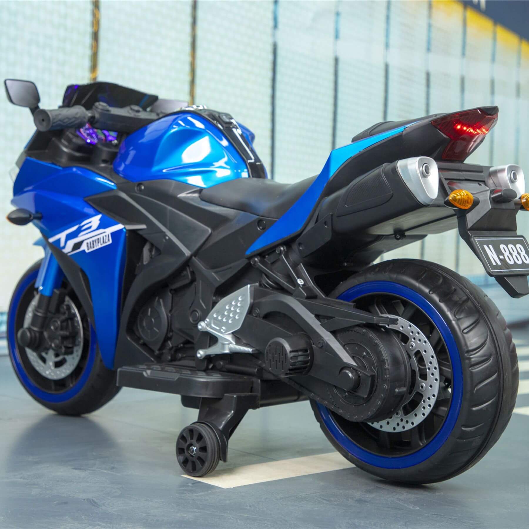 Tamco Kids 12V Motorcycle with Training Wheels - Blue on a reflective surface.