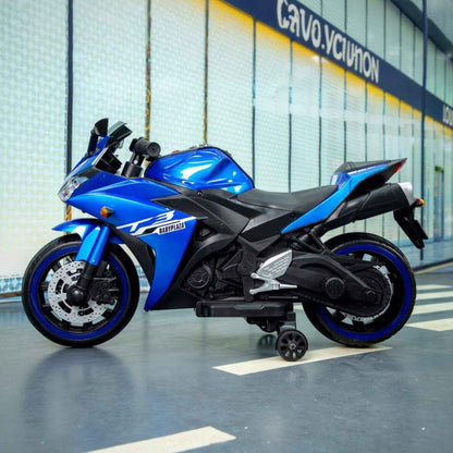 Tamco Kids 12V Motorcycle with Training Wheels - Blue in a garage with 'Cruze' branding.