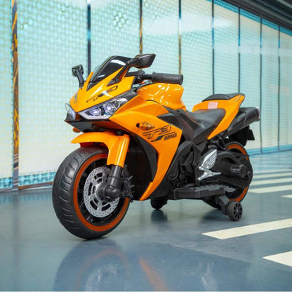 Tamco Kids 12V Motorcycle with Training Wheels - Orange on a reflective floor with a tiled wall background