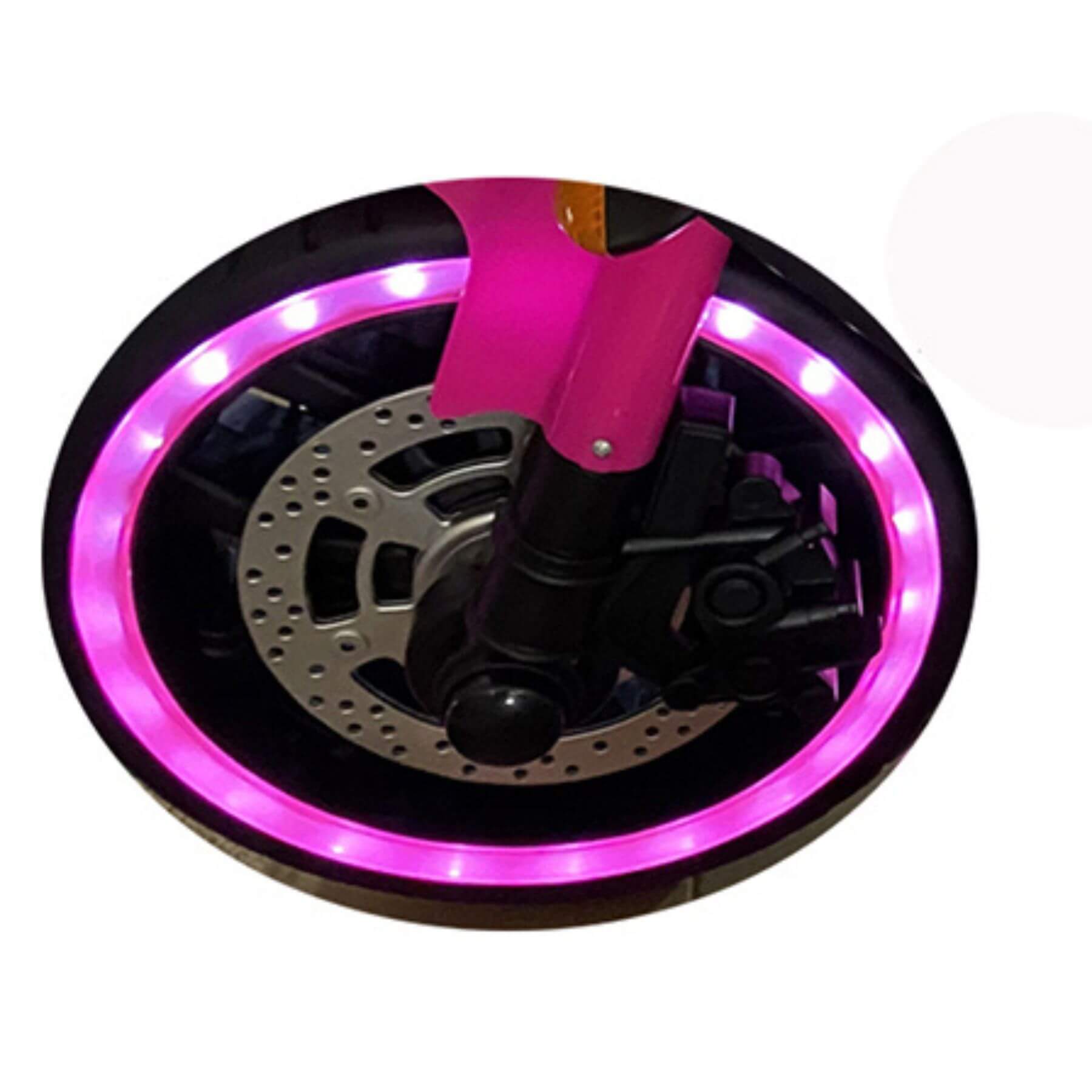 Close-up of a motorcycle wheel with pink LED rim on a white background