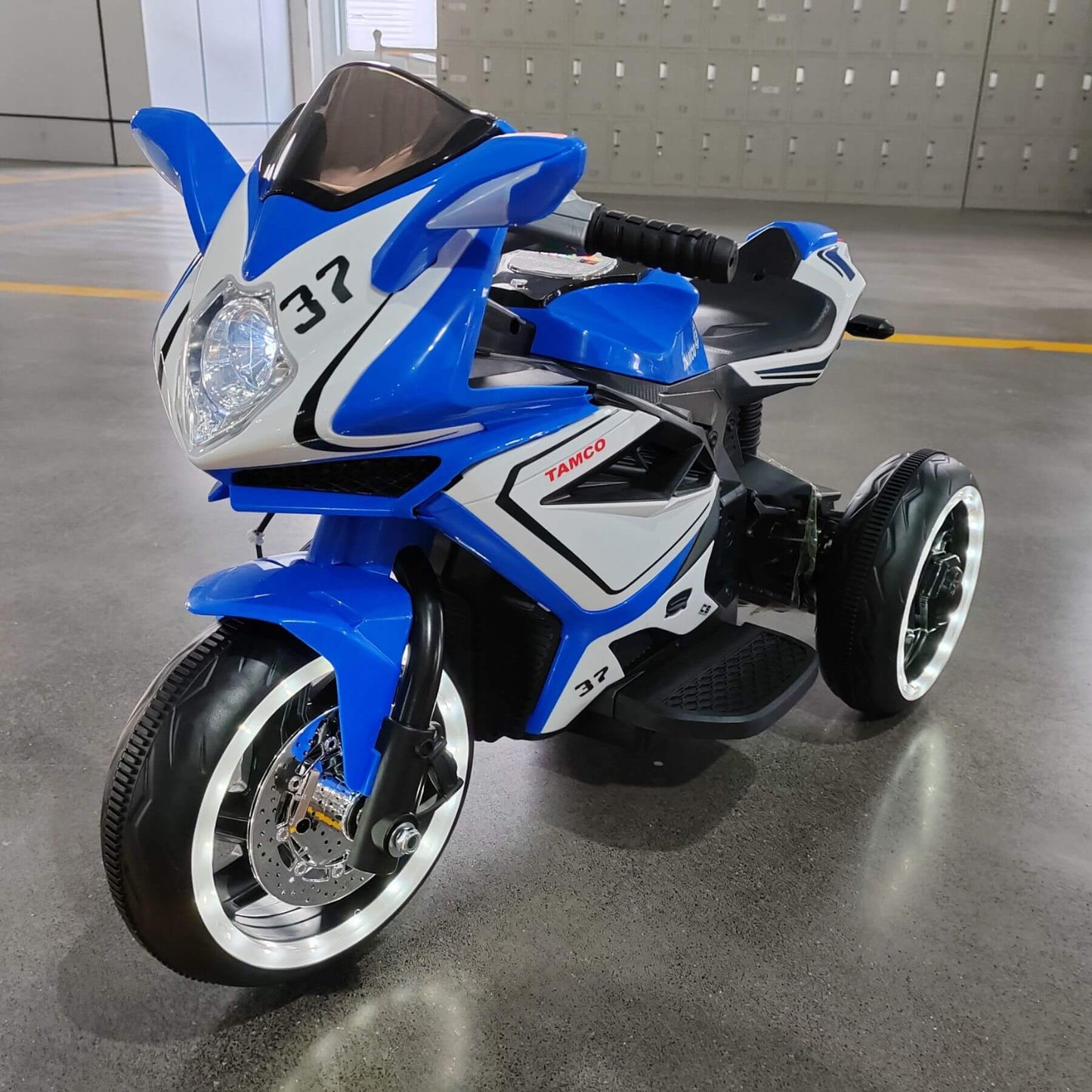 Tamco 6V Kids Electric Motorcycle for 3-4 Years Boys - Blue on a gray floor