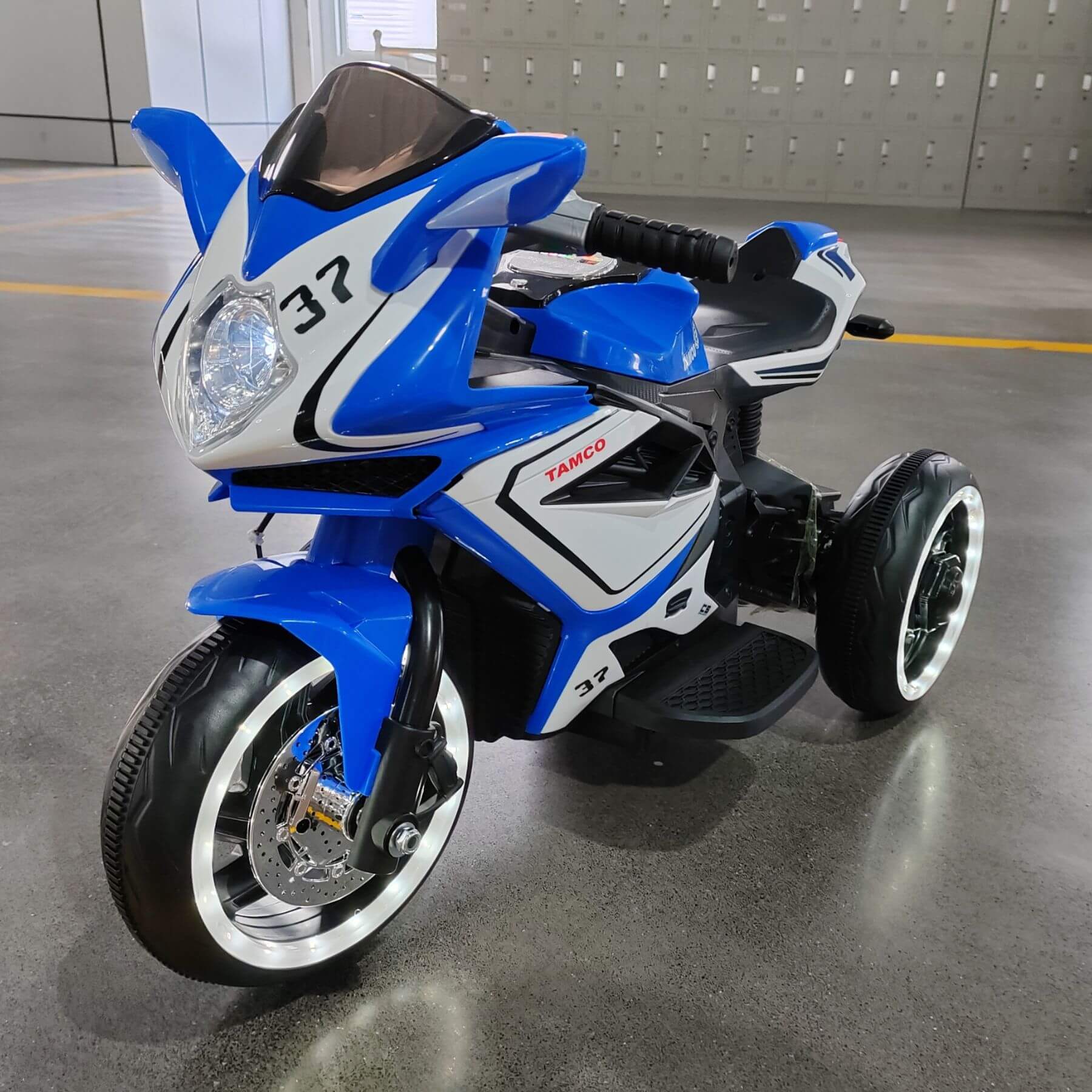 Tamco 6V Kids Electric Motorcycle for 3-4 Years Boys - Blue on a gray floor