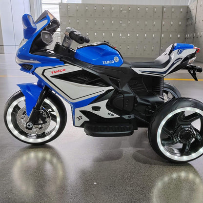 Tamco 6V Kids Electric Motorcycle for 3-4 Years Boys - Blue on a reflective floor.