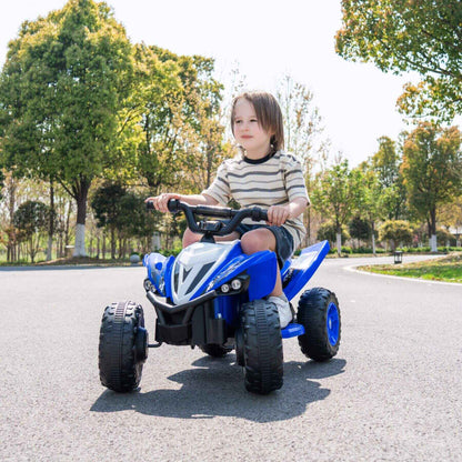 Child riding Tamco Kids Dual Motor Electric Ride On Toy - Blue on a road with trees in the background