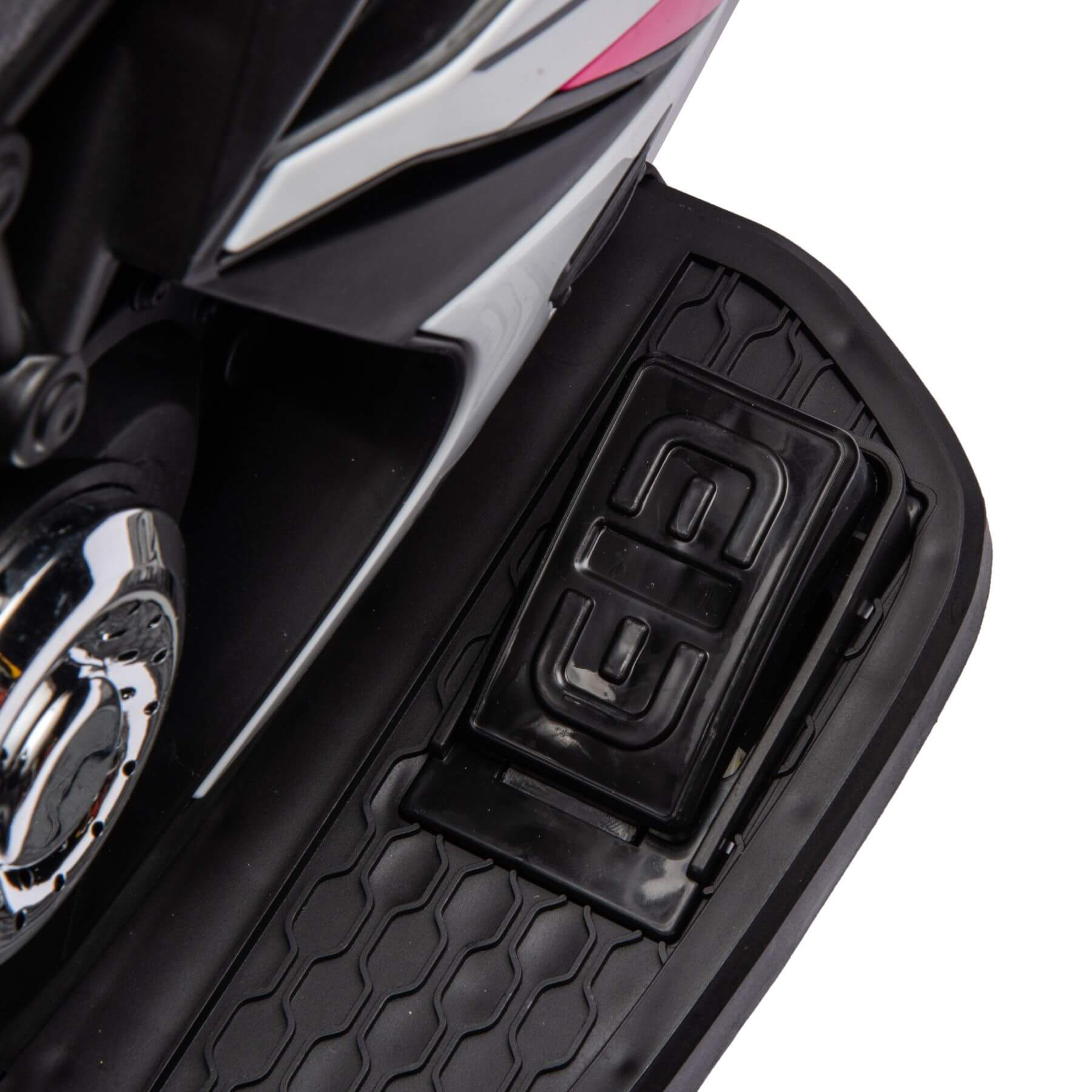 Close-up of a motorcycle's foot peg with a brand logo on a white background