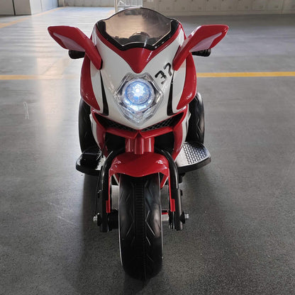 Tamco 6V Kids Electric Motorcycle - Red on a gray floor.