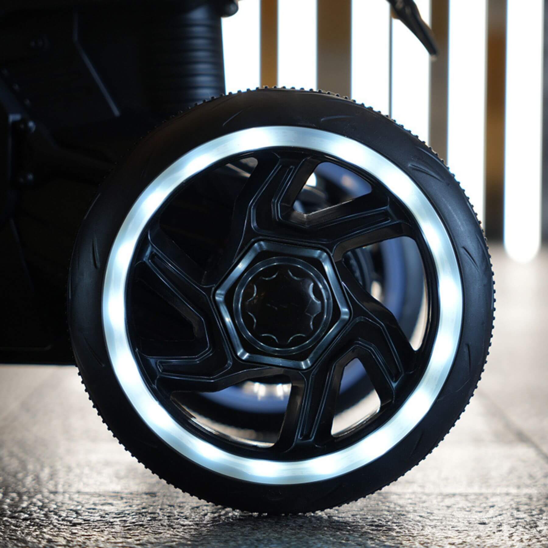 Close-up of a black wheel with a metallic rim on a vehicle.