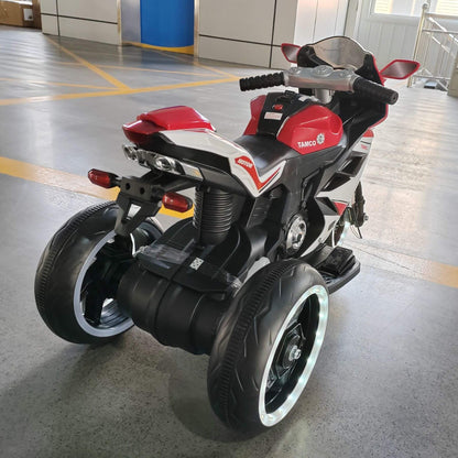 Tamco 6V Kids Electric Motorcycle - Red on a concrete floor.