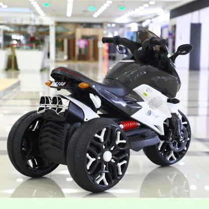 Tamco Kids Motorcycle Ride-On 3-Wheels Battery Powered Motorbike - White on a reflective floor with a blurred indoor background