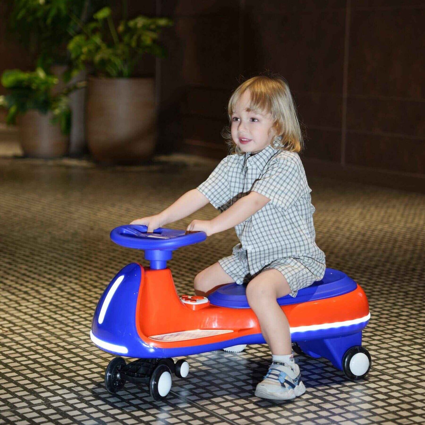 Child playing with Tamco 12V Battery Electric Twist Car indoors