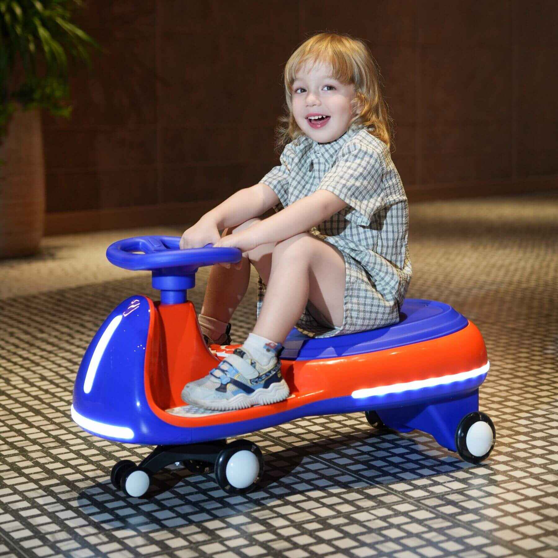 Child sitting on Tamco 12V Battery Electric Twist Car on a tiled floor.