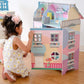 Girl Playing with Teamson Kids Sunroom Dollhouse Multicolor