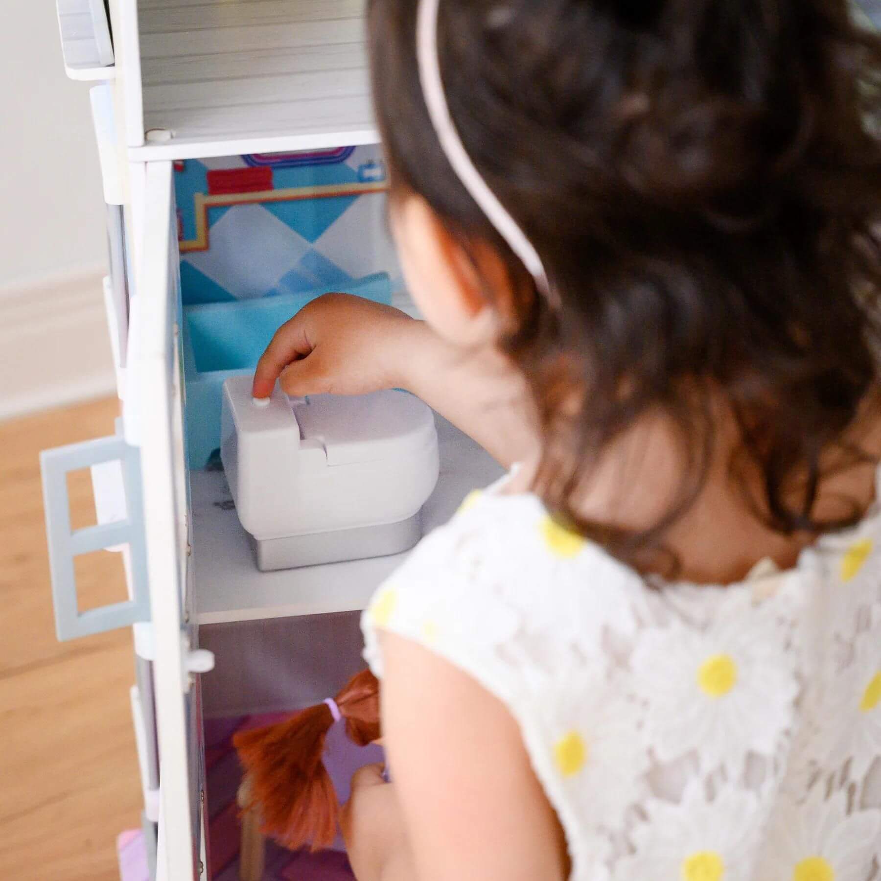 Girl Playing with Teamson Kids Sunroom Dollhouse Multicolor