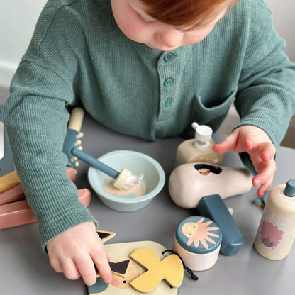 Child playing with Tender Leaf Hair Salon on a table
