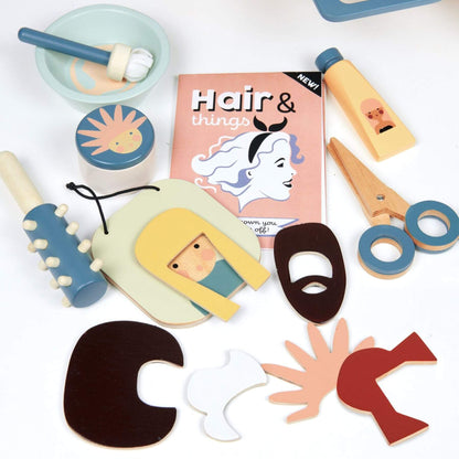 Collection of wooden hair styling toys and accessories on a white background