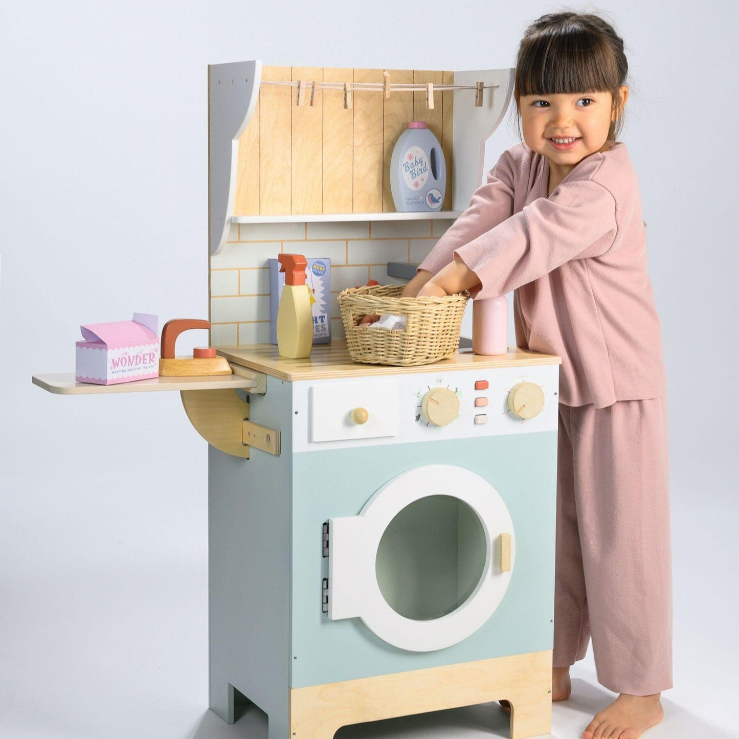 Child playing with Tender Leaf Laundrette